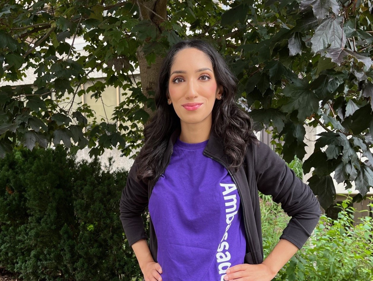 Photograph of Sadia standing on campus.